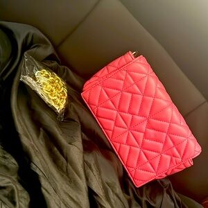 Cute padded brand new pink hand bag with gold chain strap